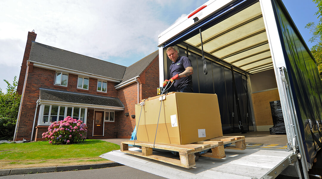 Palletways driver delivering to domestic residence